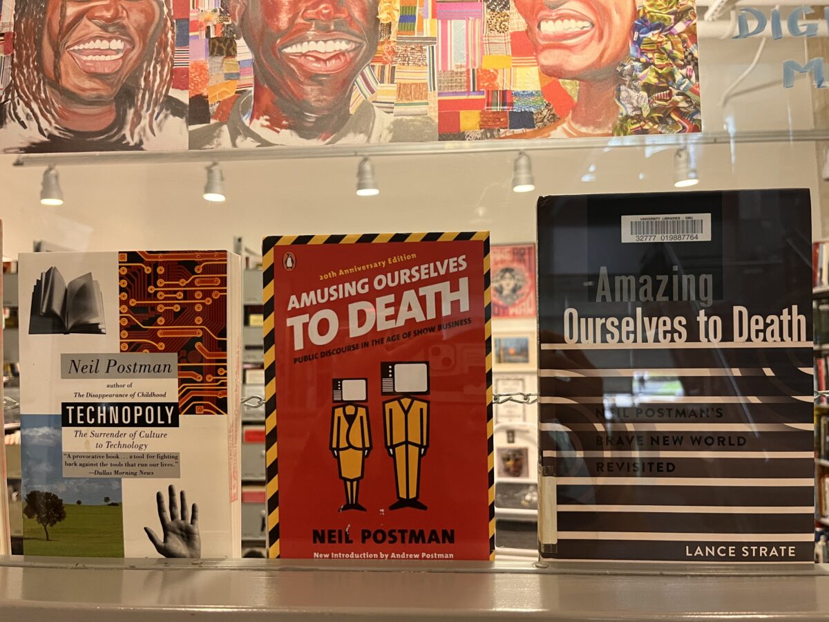 A photograph of books on the window at a library